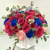 A striking mix of hot pink, vivid blue, and soft blush roses