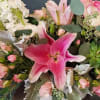 THIS WHIMSY GARDEN FLORAL IN HIGHLIGHTED IN PINKS AND WHITE WITH A