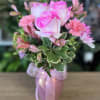fresh flowers in pink vase 