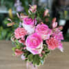 fresh flowers in pink vase 