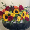 Long and low whitewashed wooden box filled with premium greens, roses, spray