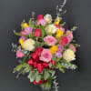Send an explosion of color with this long-stemmed rose arrangement perfect for