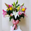 &quot;Elegant arrangement in a decorative jug, composed of majestic lilies and delicate