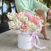 A graceful harmony of pastel blooms, this flower box brings together delicate