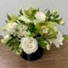 combinations of white and green flowers in a glass vase