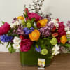 pink ceramic vase with a 4 pink peony and purple leseantus, arranged