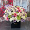 Brighten any space with our Elegant Flower Box Arrangement! Bursting with vibrant