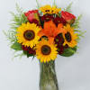 A Festive Sunflower Vase Mix With A Colorful Orange Rosas , Asiatic