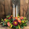 Traditional centerpiece with 2 taper candles will give a warm glow to