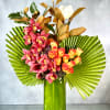Dreams really do come true with this lovely floral composition featuring orange