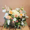 Versatile low full arrangement.  Garden style centerpiece. A classic timeless look