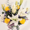 A lovely and fragrant bouquet full of white lilies, lavender wax flower