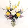 A lovely and fragrant bouquet full of white lilies, lavender wax flower