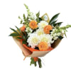 Orange and white dahlias with white snapdragons wrapped in brown paper. As
