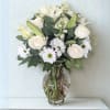 Peaceful Elegance is a serene and graceful arrangement that speaks volumes in