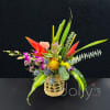 Celebrating love and humidity ;). Composed of tropical blooms within a glass
