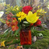 A crisp autumn mix of daisies, lilies, roses, and alstroemeria with added