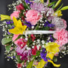 A basket of bright, colorful flowers to pick up anyone&#039;s spirits. Includes
