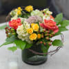 Hydrangeas, sedium, hypericum berries, yellow stock, lemon leaf, honey suckle vine, and