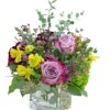 This delicate arrangement brings whispers of summer to the table. Arrangement includes