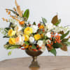 Bring warmth and sophistication to any space with this elegant fall arrangement.