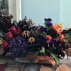 The hydrangeas, calla lilies, gerberas, lisianthus, and amarantus will haunt your heart