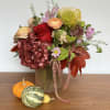 Behold the stunning fall flower arrangement in a Bellini vase with a