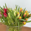 Brighten someone&#039;s day with a contemporary arrangement of 30 vibrant tulips elegantly