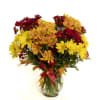 A sweet array of fall daisies accented with preserved leaves makes the