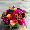 A moody jewel tone floral piece with a mix of fall blooms.