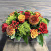 A beautiful floral piece perfect for the center of a table in