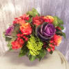 A mix of fall roses, berries, hydrangea and seasonal kale create a