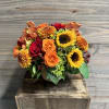 A fuller fall arrangement comprised of premium blooms including orchids, roses, spray