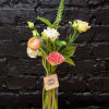 Handful of blooms of assorted and greenery in bud vase.
*PLEASE NOTE- This