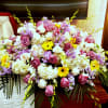 casket cover with lavender roses, white hydeangeas, yellow gerberas, white dendrobium orchids