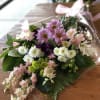 A beautiful mixed medley of cheerful flowers in a cut bouquet to