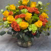 A vibrant and lively arrangement of yellow and orange roses , lime