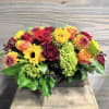 A beautiful and stunning floral piece perfect for the center of a