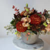 Celebrate the Fall season with the beautiful arrangement of persimmon, blush, golden