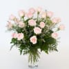 A stunning and dramatic display of expertly arrangement long-stemmed roses nestled among