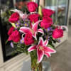 roses and lilies mix in a vase 