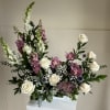 A delicate design featuring pink-toned orchids, symbolizing love, grace, and timeless elegance.