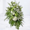 The Peaceful Garden Standing Spray is a graceful tribute of white lilies