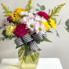 The Carla is a daisy and carnation mix. The perfect gift for