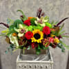 Fall centerpiece with sunflowers, roses, protea, fuji mums, hydrangea, safari, cushion mums