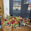 Long Centerpiece with rustic color and pheasant feathers.