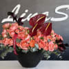 A stunning arrangement of pink, red, and purple flowers, blending romance, passion