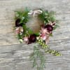 A romantic blend of elegance and whimsy, this flower crown is crafted