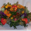 An exquisite collection of fall colored blooms artfully arranged in a &quot;long&quot;