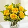 6 yellow roses in a clear cube with sword fern and solidago